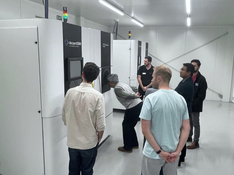 Displaying one of Zenith Tecnica's Arcam Q10+ EBM Machines to a tour group